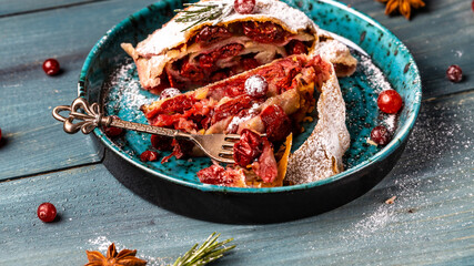 freshly baked cherry strudel with cranberry and rosemary. classic recipe, Traditional Austrian cuisine