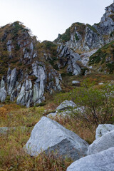 Rock formations in early autumn at Senjojiki Cirque in Nagano Prefecture, Japan.