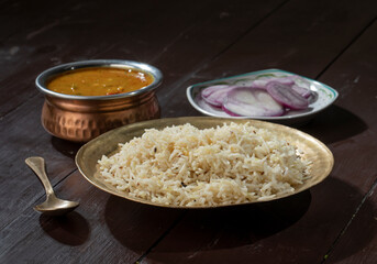 Indian Cuisine Jeera Rice With Dal Tadka Also Know As Cumin Rice on Vintage Wooden Background