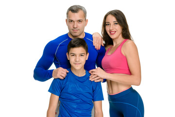 Smiling sporty healthy family of three people posing on white background