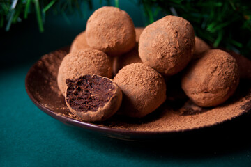 homemade chocolate balls truffles on the plate.