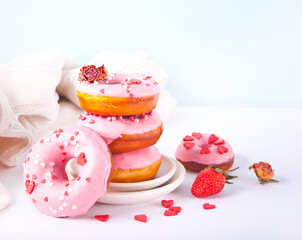 Stack of pink doughnuts on the plate. Valentine's Day concept.