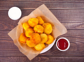 Potato croquettes balls on the plate and dips sauces