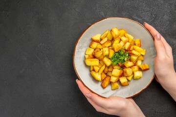 top view tasty fried potatoes inside plate with greens on dark background oil french fries food photo color dinner free place