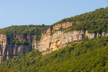 Fototapeta na wymiar Sheer rock, face like cliff called Eagle shelf, Mezmay, Krasnodar region, Russia