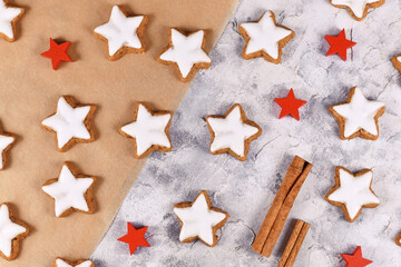 Fototapeta na wymiar German star shaped glazed Christmas cookies called 'Zimtsterne' made with amonds, egg white, sugar, cinnamon and flour