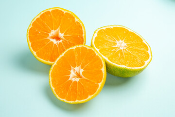 front view fresh tangerine slices on a light-blue background fruit orange photo color citrus...