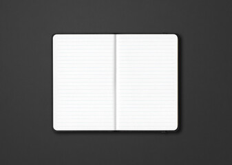 Black open lined notebook isolated on dark background