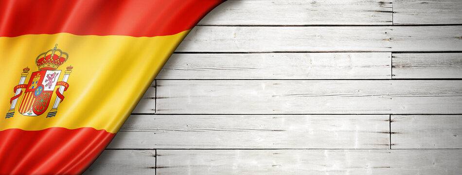 Spanish flag on old white wall banner