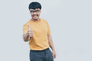 Naklejka premium adult asian man.young male wear eye glasses.posing smiling look excited surprised thinking positive happy joy life.empty,copy space for text advertising.white background.attractive fashion people