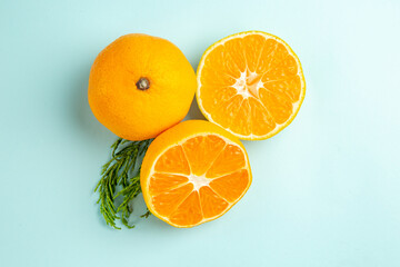 top view fresh tangerine slices on light-blue background photo fruit citrus orange color
