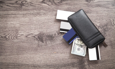 Black leather wallet, credit card and money.