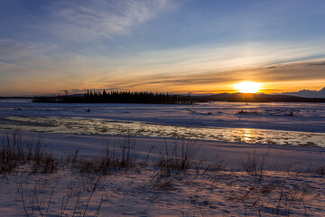 Beautiful sunset over Tanana river in Alaska winter