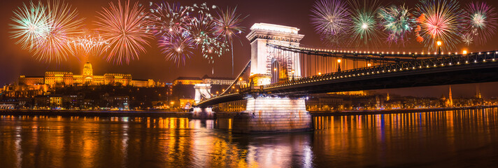 Chain bridge panorama with fireworks overlooking Buda side of the city, Celebration of new year in...