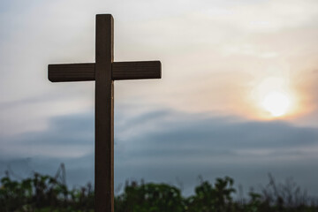 Silhouette cross on mountain at sunset background.Crucifixion Of Jesus Christ