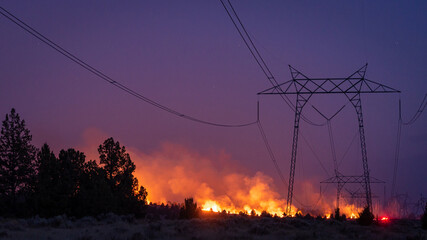 California wildfire burns under power lines 