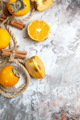 top view fresh persimmons with orange on light background fruit ripe mellow color photo