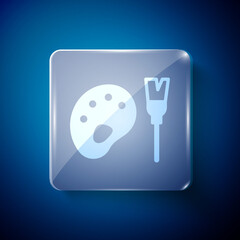 White Paint brush with palette icon isolated on blue background. Square glass panels. Vector.