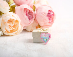gift box with heart on abstract light background. Valentine's day, birthday, Mother's Day concept. Romantic Holiday season.