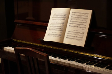 Piano keyboard and sheet music