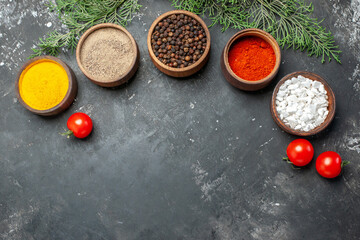 top view different seasonings with tomatoes on a grey background color pepper photo food