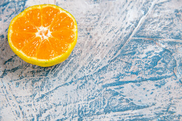 front view fresh tangerine slice on light-blue background citrus photo fruits juice color