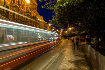 Fototapeta na wymiar Streetcar or Tram in the old town area of Prague, Czech Republic or Czechia at night