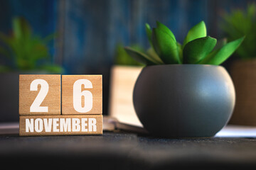 november 26th. Day 26 of month, Cube calendar with date and pot with succulent placed on table at home Simple calendar. autumn month, day of the year concept