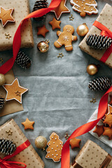 Composition of Christmas gift boxes, cookies, cones. flatley layout of ginger holiday cookies with a blank background.