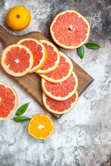 top view fresh grapefruits sliced fruits on light-background citrus fresh juice fruit photo