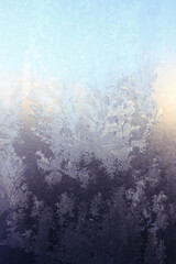 New year Christmas background. Frosty pattern, freeze on the window in winter. Vertical orientation