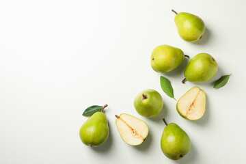 Fresh green pears on white background, top view