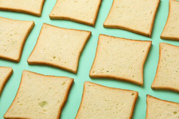 Flat lay with toast breads on mint background