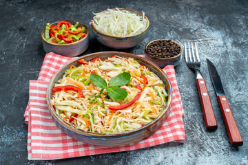 front view tasty vegetable salad with sliced cabbage and bell-peppers on grey background meal color photo diet health