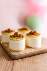 Delicious airy dessert mousse. Cake with berries. The treat is on a table in a cafe. Anna Pavlova