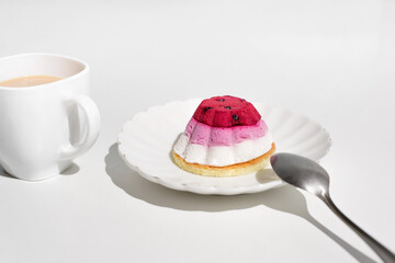 Cup of tea and a cake with blueberries, close-up. Morning breakfast with dessert in the kitchen.