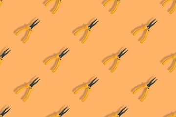 Seamless pattern.Seamless pattern of tools. Pliers background.