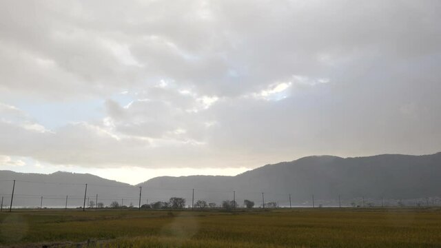 A view of Lake Yogo with cloudy sky and rain