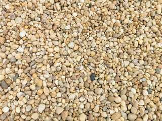 View of textures of various cobble stones, yellowish colors, used for roofing of buildings