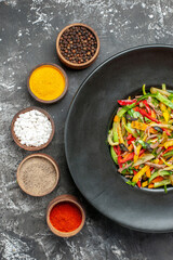 top view tasty vegetable salad with seasonings on the light-grey background meal color photo health food