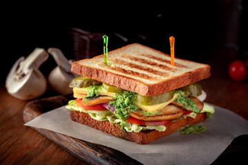Vegetarian club Sandwich with fried mushrooms, vegetables and guacamole sauce
