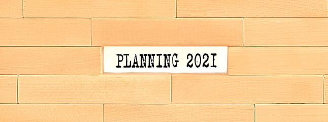 PLANNING 2021 text on the wooden block wall, business