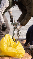 person picking up trash