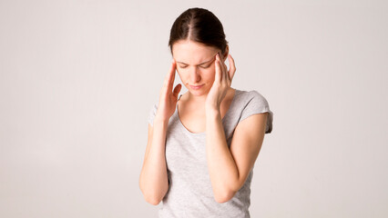 Young beautiful woman has headache