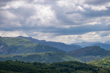 Fototapeta na wymiar Mountain landscape against cloudy sky
