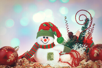 cheerful snowman and Christmas toys on white background.