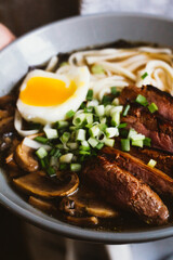 Asian noodle soup with mushrooms and eggs.