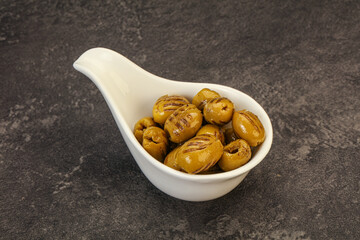 Green grilled olives in the bowl