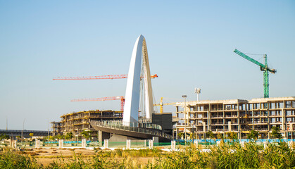 Obraz premium View of a well known landmark of Dubai, Tolerance bridge. Shot made from safa park. Outdoors