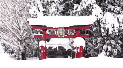 Snowfall and snow covered shrine in Japan / 4K